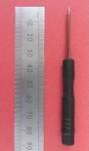 8.5 cm long screwdriver for n guage model railway track screws shown besides a metal rule